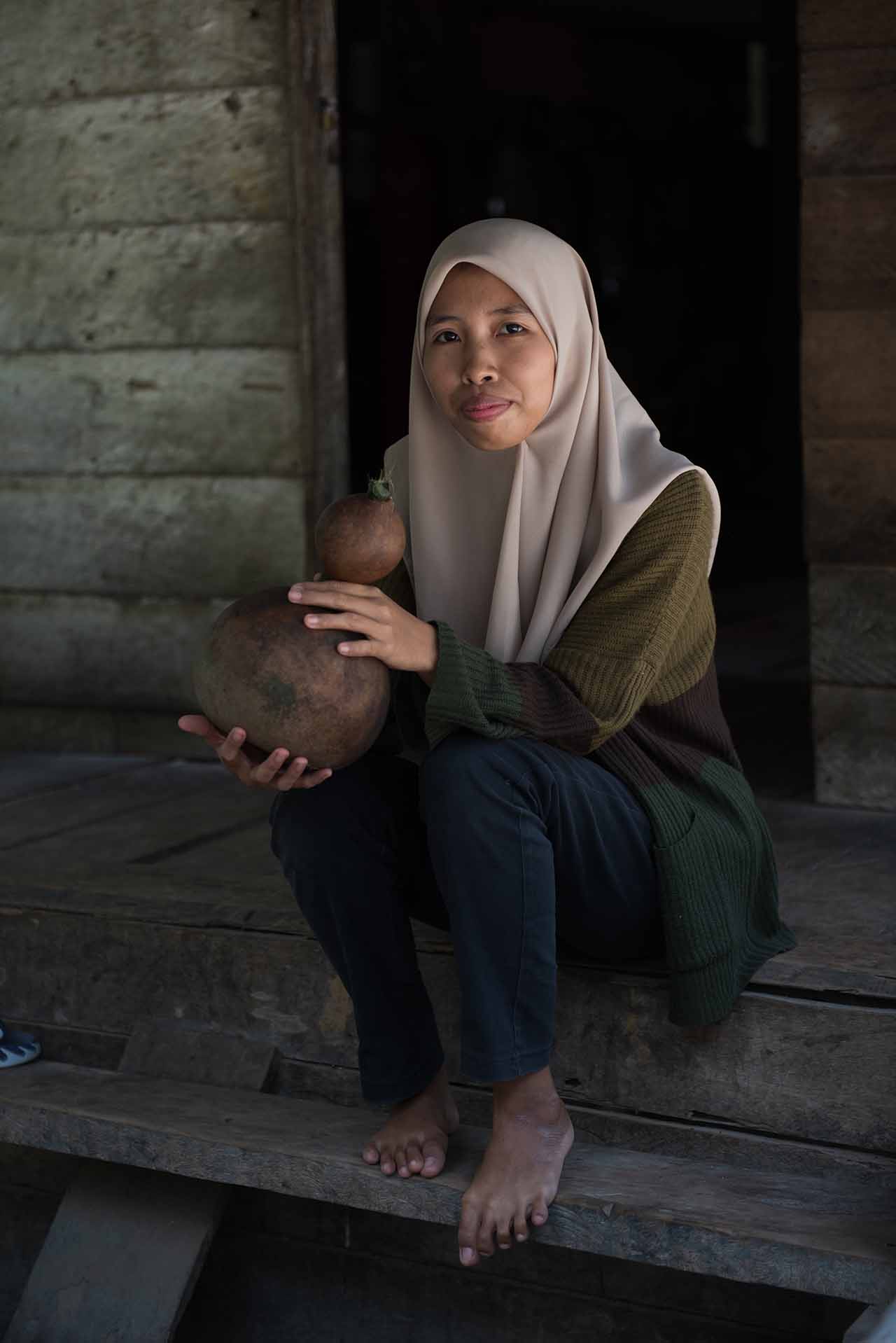 Ayu, an Indigenous Talang Mamak youth from Riau province in Sumatra, Indonesia. | Credit: Jacob Maentz